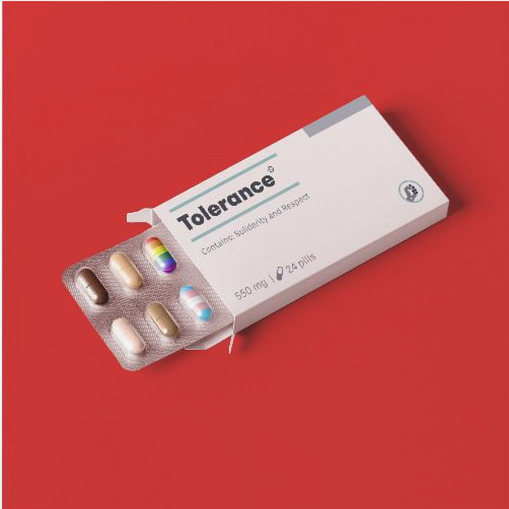 A framed conceptual art piece on a bright red background. It features a white medicine box labeled 'Tolerance', with a blister pack of pills emerging. Most pills are in various skin tones, but one is a rainbow pride flag and another is a transgender pride flag. Artwork