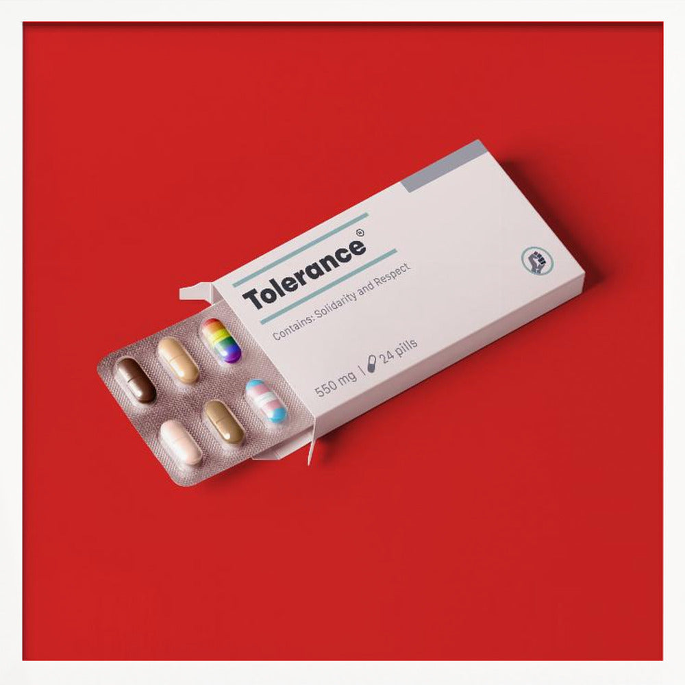 A framed conceptual art piece on a bright red background. It features a white medicine box labeled 'Tolerance', with a blister pack of pills emerging. Most pills are in various skin tones, but one is a rainbow pride flag and another is a transgender pride flag. Artwork