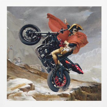 A framed parody artwork of the classic painting 'Napoleon Crossing the Alps.' Instead of a horse, Napoleon Bonaparte is performing a dramatic wheelie on a modern black and red motorcycle. He wears sunglasses, his signature bicorne hat, and a flowing red cape against a snowy, mountainous backdrop. Print