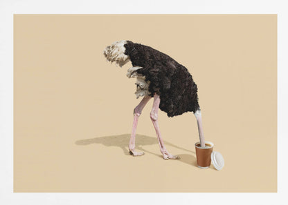 A humorous and surreal image of a black and white ostrich with its head buried inside a disposable coffee cup, set against a plain beige background and enclosed in a silver frame. Decor