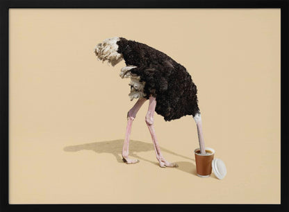 A humorous and surreal image of a black and white ostrich with its head buried inside a disposable coffee cup, set against a plain beige background and enclosed in a silver frame. Decor