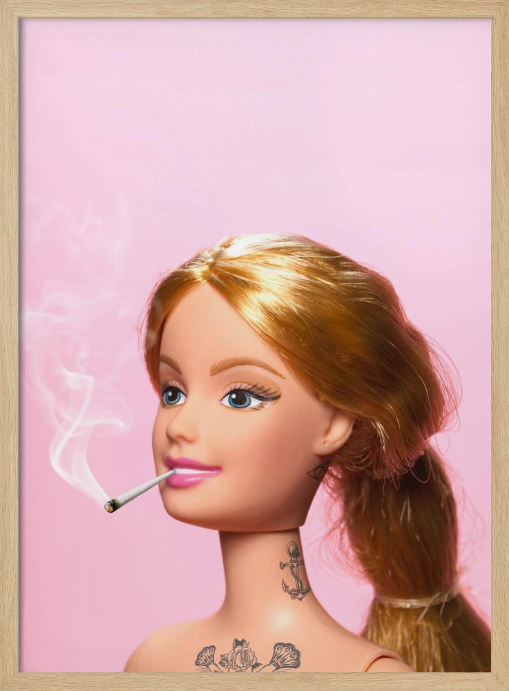 A close-up photograph of a blonde doll, resembling Barbie, with tattoos on her neck and chest, smoking a joint against a solid pink background. Smoke curls upwards from the lit cigarette in her pink-lipsticked mouth. Artwork