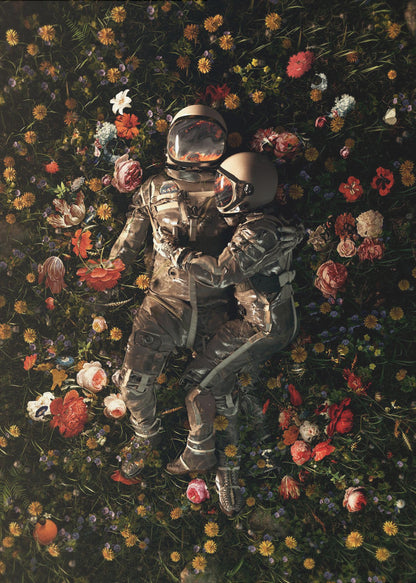 An overhead view of two astronauts in full gear, embracing each other while lying down in a lush, dark field filled with a vibrant array of colorful flowers. Wall Art