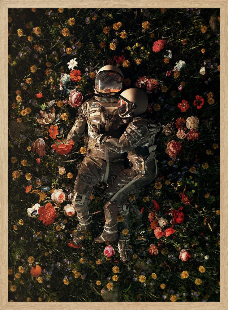 An overhead view of two astronauts in full gear, embracing each other while lying down in a lush, dark field filled with a vibrant array of colorful flowers. Wall Art