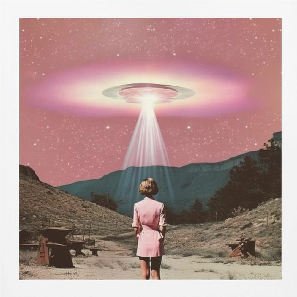 A vintage-style collage artwork in a wood frame depicting a woman in a pink dress standing in a desert landscape, looking up at a large UFO hovering in a pink, starry sky and beaming down a bright light. Print