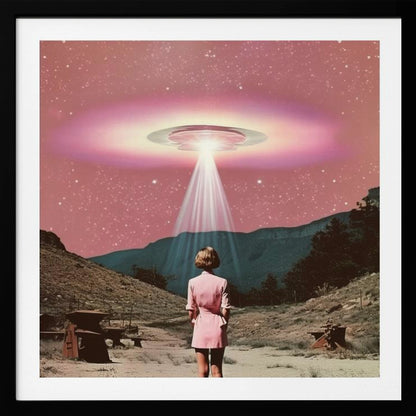 A vintage-style collage artwork in a wood frame depicting a woman in a pink dress standing in a desert landscape, looking up at a large UFO hovering in a pink, starry sky and beaming down a bright light. Print