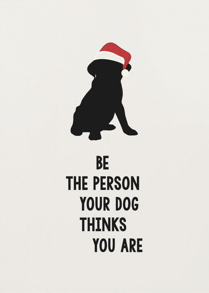 A framed art print featuring a black silhouette of a dog wearing a red Santa hat on an off-white background. Below the dog is the motivational quote, 'BE THE PERSON YOUR DOG THINKS YOU ARE' in black block letters. Decor