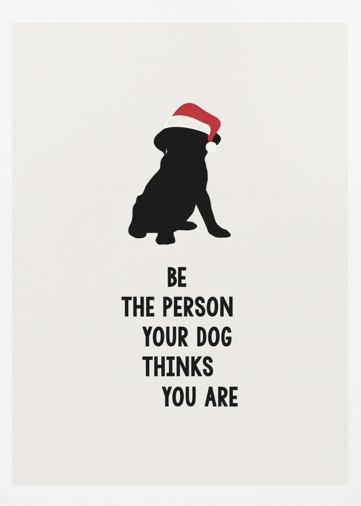 A framed art print featuring a black silhouette of a dog wearing a red Santa hat on an off-white background. Below the dog is the motivational quote, 'BE THE PERSON YOUR DOG THINKS YOU ARE' in black block letters. Decor