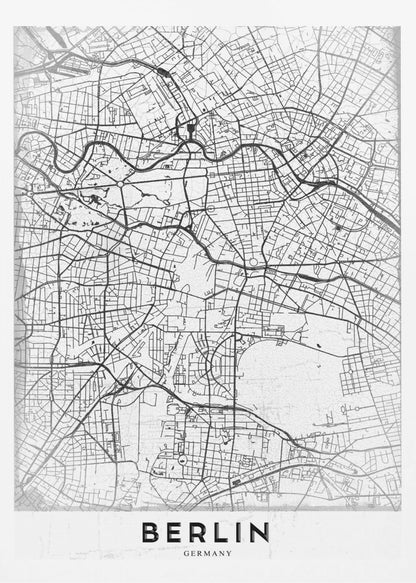 A minimalist black and white poster of a street map of Berlin, Germany. The map's intricate network of roads and waterways is depicted with black lines on a white, slightly textured background. The artwork is enclosed in a simple black frame, with the word 'BERLIN' printed in bold, black capital letters at the bottom center. Wall Art