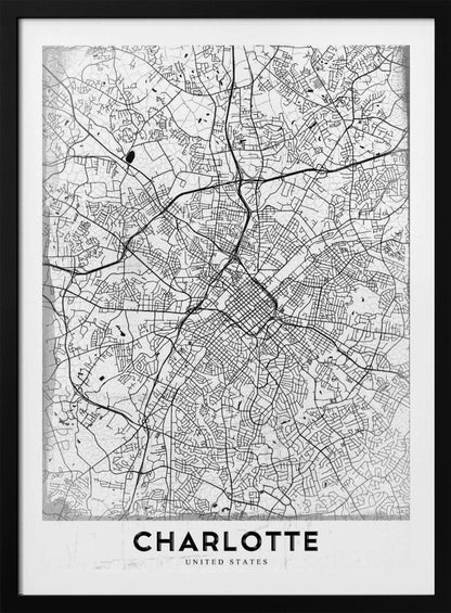 A minimalist black and white map of Charlotte, North Carolina, displayed in a black frame. The map details the intricate network of city streets and highways. At the bottom, a white banner features the city's name 'CHARLOTTE' in a bold, black, sans-serif font. Poster