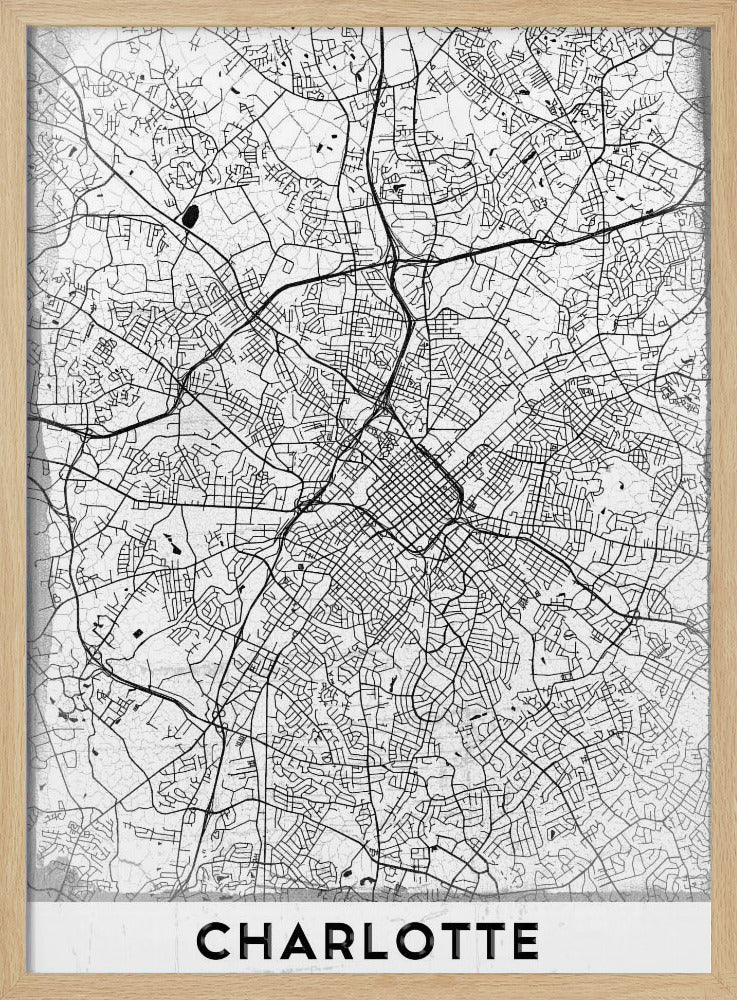 A minimalist black and white map of Charlotte, North Carolina, displayed in a black frame. The map details the intricate network of city streets and highways. At the bottom, a white banner features the city's name 'CHARLOTTE' in a bold, black, sans-serif font. Poster
