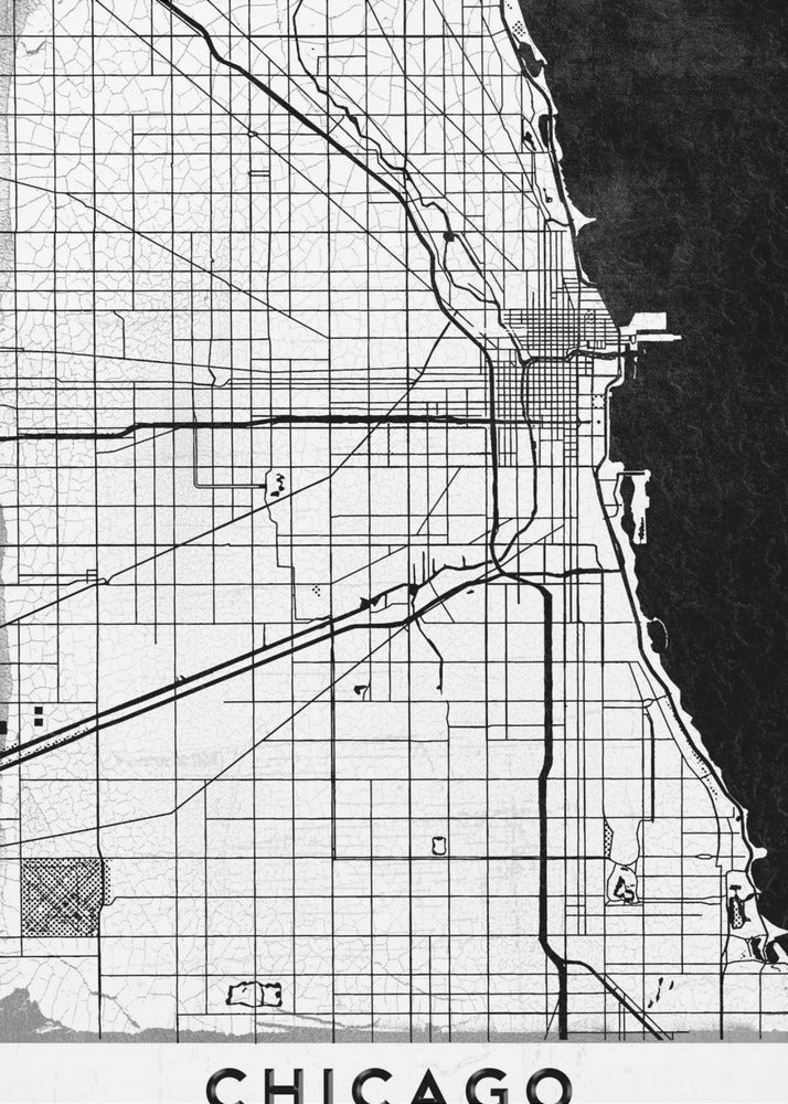 A minimalist black and white map of Chicago, featuring a grid street layout, major thoroughfares, and the shoreline of Lake Michigan. The map has a subtle crackled texture, is enclosed in a black frame, and has the word 'CHICAGO' in capital letters at the bottom. Decor