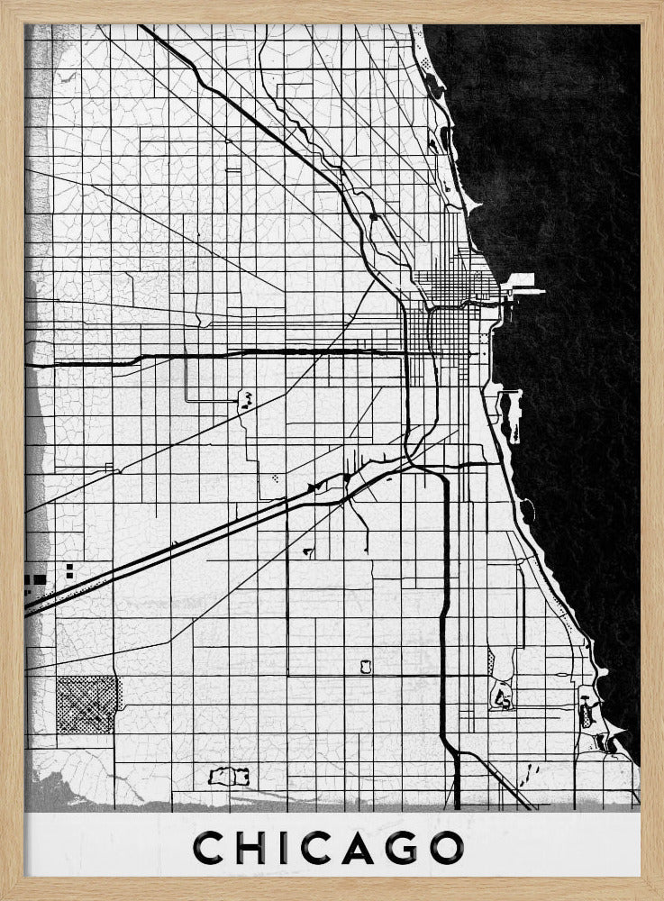 A minimalist black and white map of Chicago, featuring a grid street layout, major thoroughfares, and the shoreline of Lake Michigan. The map has a subtle crackled texture, is enclosed in a black frame, and has the word 'CHICAGO' in capital letters at the bottom. Decor