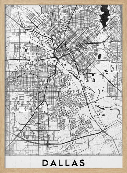 A minimalist black and white street map of Dallas, Texas, presented vertically in a black frame. The intricate network of roads and highways is depicted in black lines on a light gray, textured background, with the city's name 'DALLAS' in bold capital letters at the bottom. Poster