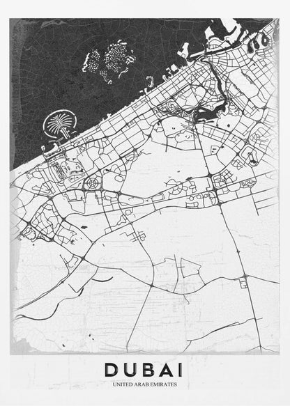 A minimalist black and white map of Dubai in a black frame. The water is depicted in black with a subtle texture, while the land is white, showing the city's road network in thin black lines. Key features like the Palm Jumeirah and The World Islands are visible off the coast. The word 'DUBAI' is written in a bold, black, sans-serif font at the bottom. Decor