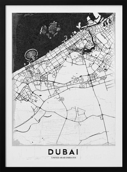 A minimalist black and white map of Dubai in a black frame. The water is depicted in black with a subtle texture, while the land is white, showing the city's road network in thin black lines. Key features like the Palm Jumeirah and The World Islands are visible off the coast. The word 'DUBAI' is written in a bold, black, sans-serif font at the bottom. Decor