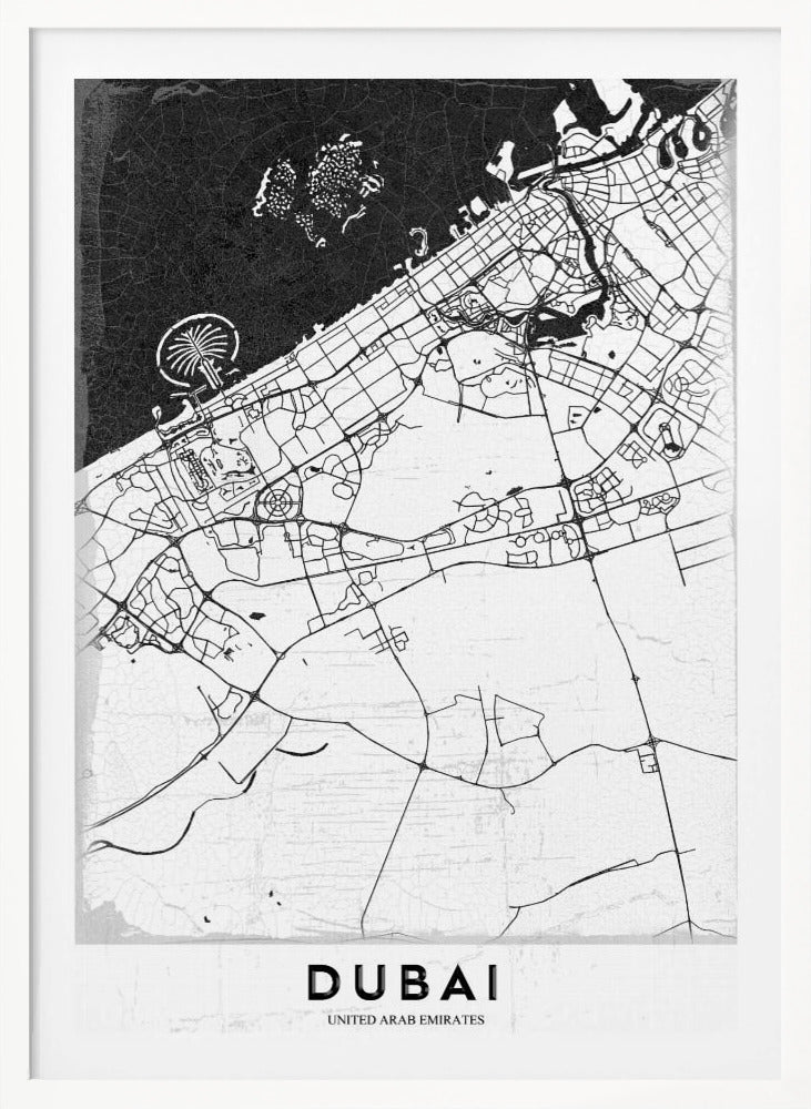 A minimalist black and white map of Dubai in a black frame. The water is depicted in black with a subtle texture, while the land is white, showing the city's road network in thin black lines. Key features like the Palm Jumeirah and The World Islands are visible off the coast. The word 'DUBAI' is written in a bold, black, sans-serif font at the bottom. Decor