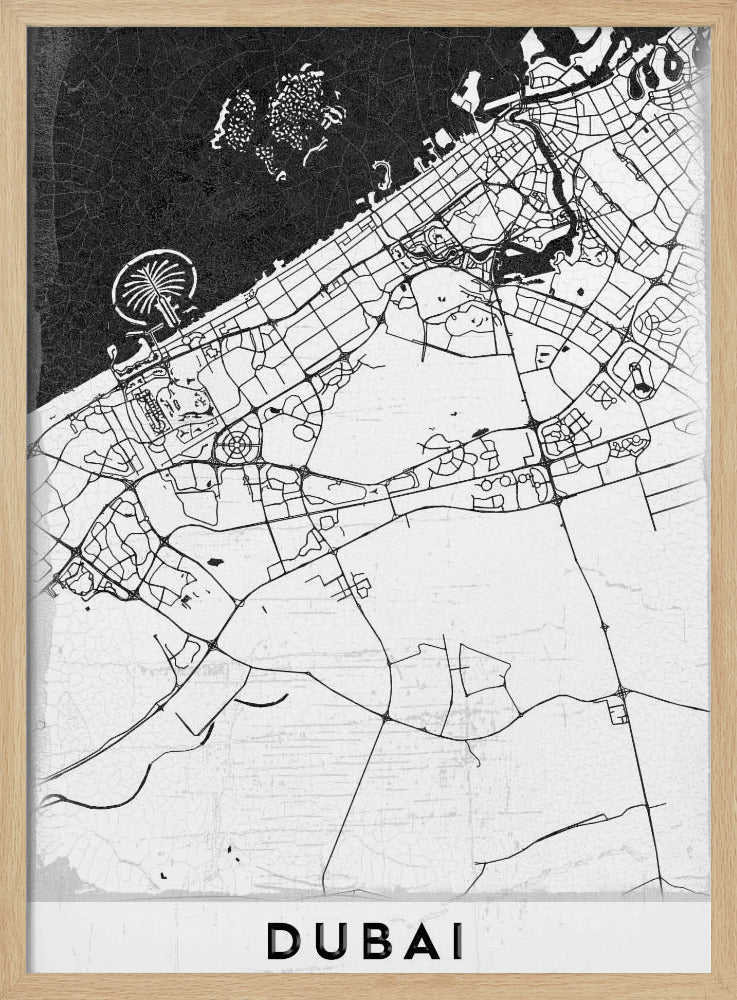 A minimalist black and white map of Dubai in a black frame. The water is depicted in black with a subtle texture, while the land is white, showing the city's road network in thin black lines. Key features like the Palm Jumeirah and The World Islands are visible off the coast. The word 'DUBAI' is written in a bold, black, sans-serif font at the bottom. Decor