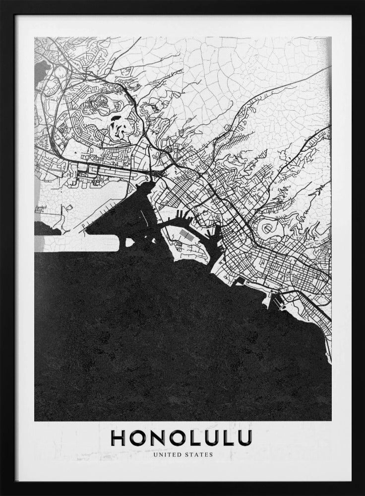 A framed, minimalist black and white map of Honolulu, Hawaii. The city's streets and coastline are rendered in black lines on a white background, while the ocean is a solid, textured black. The word 'HONOLULU' is printed in black sans-serif font at the bottom. Artwork