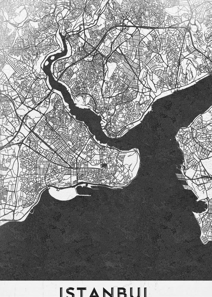 A modern black and white framed poster of a city map of Istanbul. The land is depicted in white with intricate black lines representing streets, while the bodies of water like the Bosphorus are shown in solid textured black. A white banner at the bottom displays the word 'ISTANBUL' in a bold, black, sans-serif font. Artwork