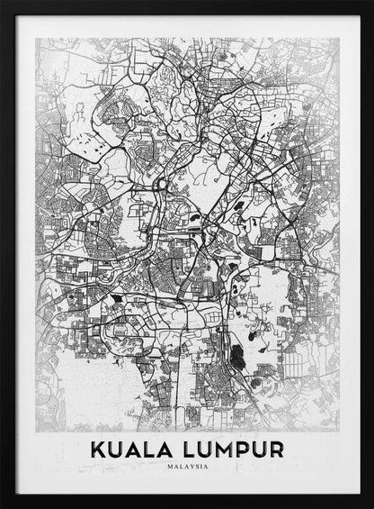 A minimalist black and white street map of Kuala Lumpur, displayed in a black frame. The map shows a detailed network of roads and city blocks on a textured white background. The name "KUALA LUMPUR" is printed in a bold, modern font at the bottom. Decor