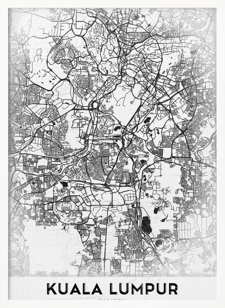 A minimalist black and white street map of Kuala Lumpur, displayed in a black frame. The map shows a detailed network of roads and city blocks on a textured white background. The name "KUALA LUMPUR" is printed in a bold, modern font at the bottom. Decor