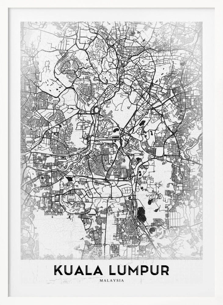 A minimalist black and white street map of Kuala Lumpur, displayed in a black frame. The map shows a detailed network of roads and city blocks on a textured white background. The name "KUALA LUMPUR" is printed in a bold, modern font at the bottom. Decor