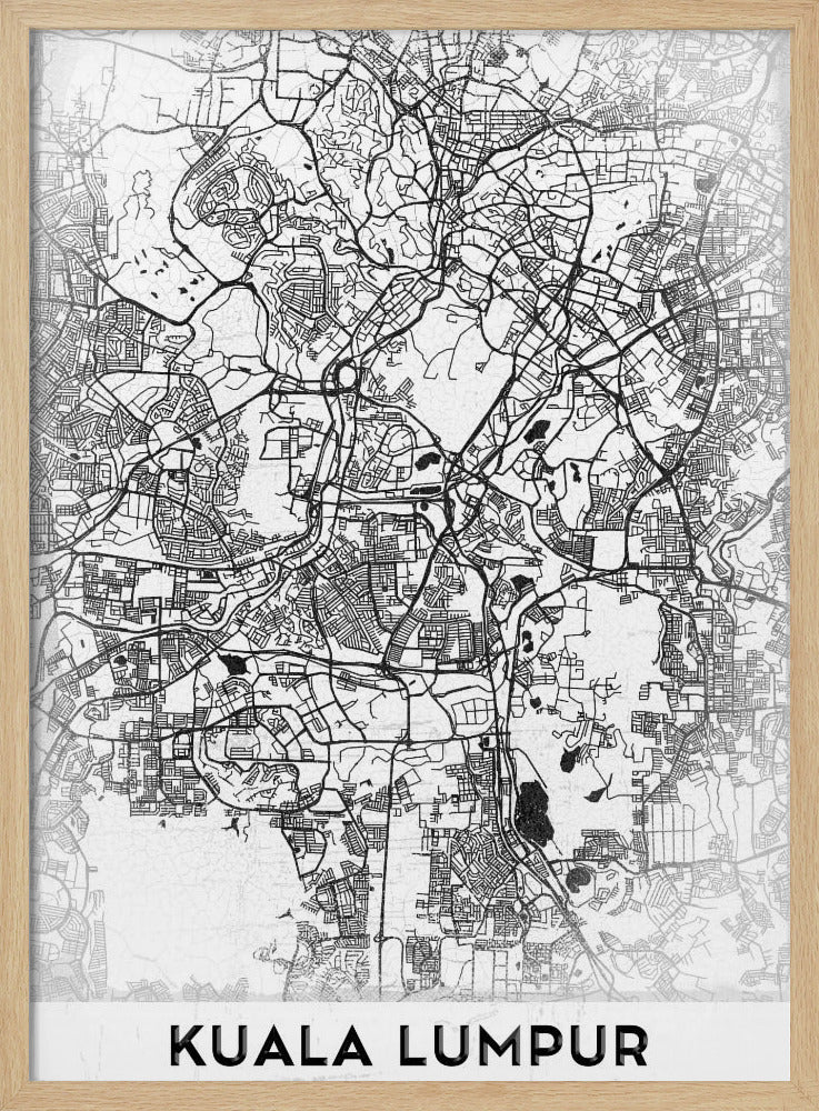 A minimalist black and white street map of Kuala Lumpur, displayed in a black frame. The map shows a detailed network of roads and city blocks on a textured white background. The name "KUALA LUMPUR" is printed in a bold, modern font at the bottom. Decor