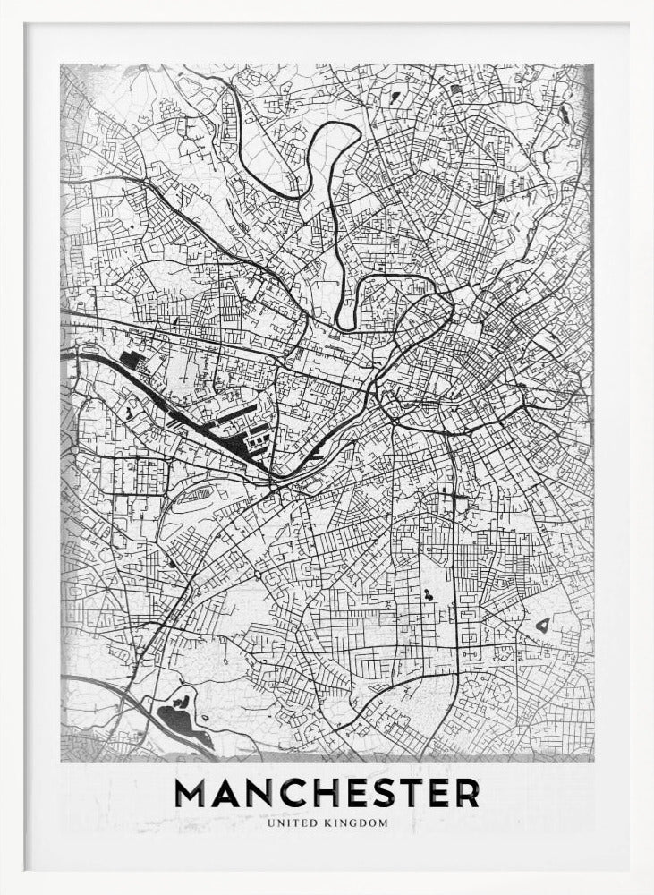 A minimalist black and white street map of Manchester, UK, displayed in a simple black frame. The map details the intricate network of roads and waterways, with the city's name 'MANCHESTER' printed in a bold, modern font at the bottom. Wall Art