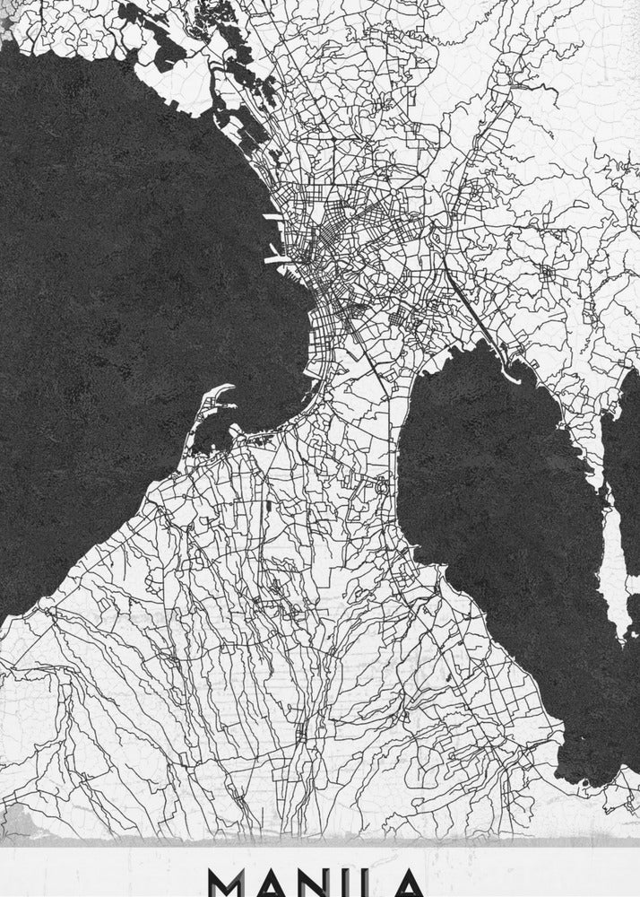 A minimalist black and white map of Manila, Philippines, presented in a black frame. The map showcases the city's intricate road network in black lines on a white landmass, contrasted against textured black bodies of water. The word 'MANILA' is printed in a bold, black sans-serif font at the bottom of the poster. Decor