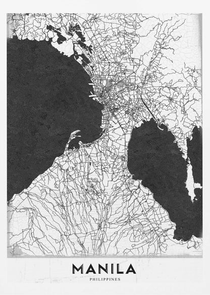 A minimalist black and white map of Manila, Philippines, presented in a black frame. The map showcases the city's intricate road network in black lines on a white landmass, contrasted against textured black bodies of water. The word 'MANILA' is printed in a bold, black sans-serif font at the bottom of the poster. Decor
