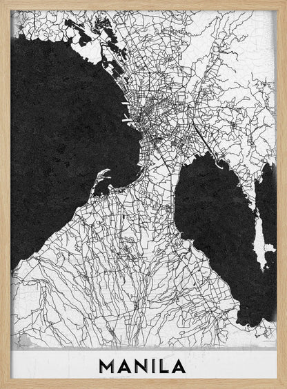 A minimalist black and white map of Manila, Philippines, presented in a black frame. The map showcases the city's intricate road network in black lines on a white landmass, contrasted against textured black bodies of water. The word 'MANILA' is printed in a bold, black sans-serif font at the bottom of the poster. Decor