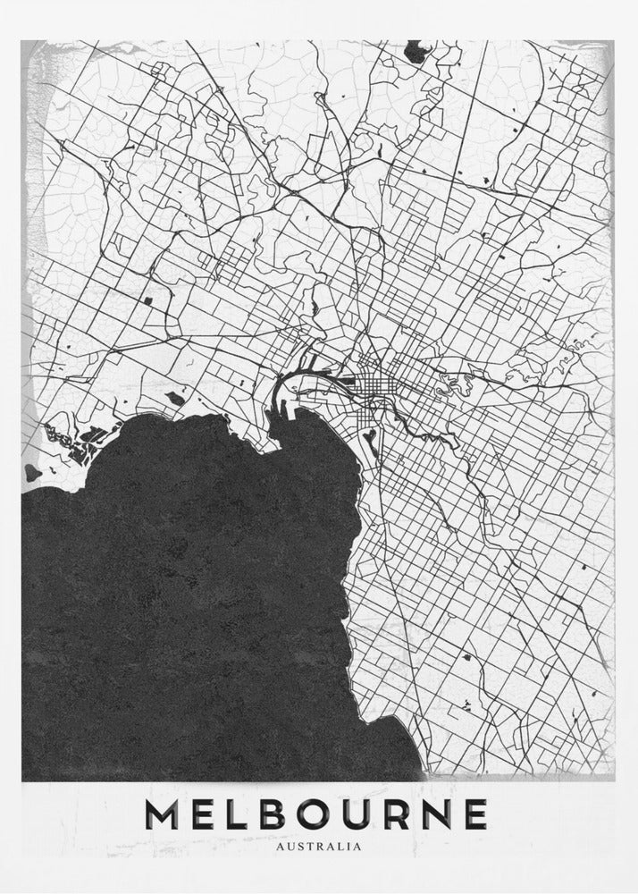 A minimalist black and white map of Melbourne, Australia, presented in a black frame. The city's road network is depicted with fine black lines on a textured white background, while the adjacent bay is shown in solid, textured black. The name 'MELBOURNE' is written in a bold, black font at the bottom. Poster