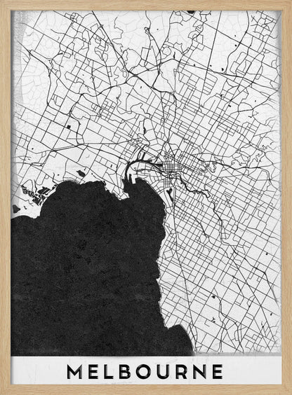 A minimalist black and white map of Melbourne, Australia, presented in a black frame. The city's road network is depicted with fine black lines on a textured white background, while the adjacent bay is shown in solid, textured black. The name 'MELBOURNE' is written in a bold, black font at the bottom. Poster