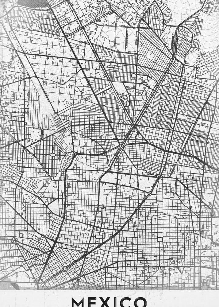 A modern, minimalist black and white art print of a street map of Mexico City, enclosed in a simple black frame. The intricate road network is depicted with black lines on a textured white background. The word 'MEXICO' is printed in bold, black capital letters at the bottom. Print