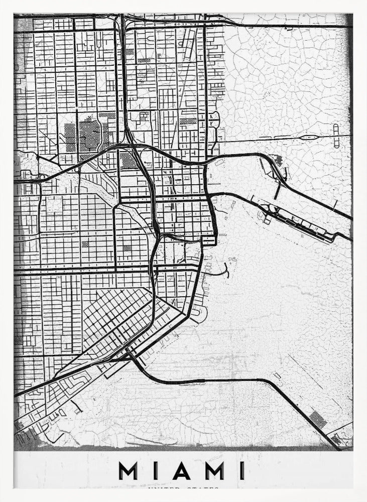 A minimalist black and white street map of Miami, Florida, with a distressed, textured background. The map is framed in black with the word 'MIAMI' printed in bold capital letters at the bottom. Artwork