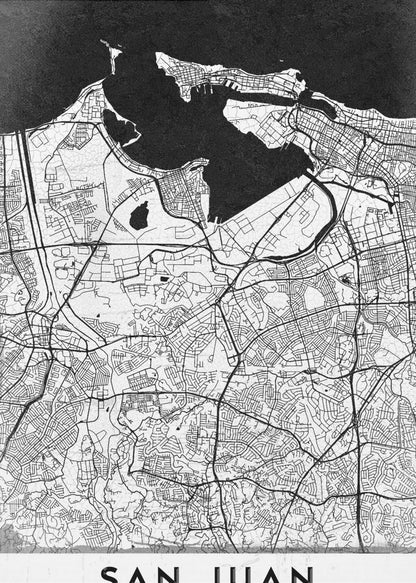 A minimalist black and white map of San Juan, Puerto Rico, shown as a framed poster. The land is depicted in white with intricate black lines for roads and streets, while the surrounding water is a solid, textured black. A white banner at the bottom features the text 'SAN JUAN' in a bold, black, sans-serif font. Artwork