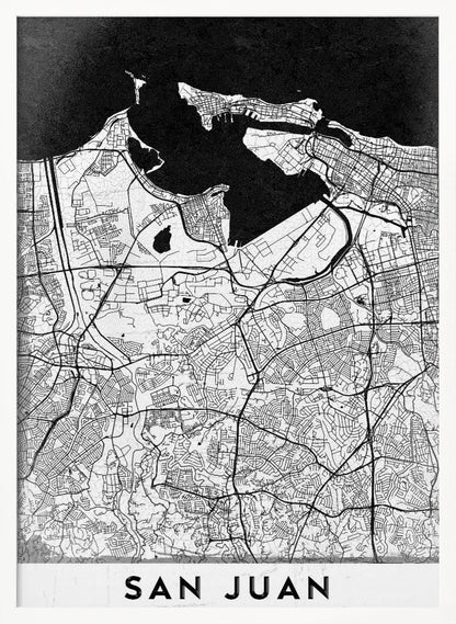 A minimalist black and white map of San Juan, Puerto Rico, shown as a framed poster. The land is depicted in white with intricate black lines for roads and streets, while the surrounding water is a solid, textured black. A white banner at the bottom features the text 'SAN JUAN' in a bold, black, sans-serif font. Artwork