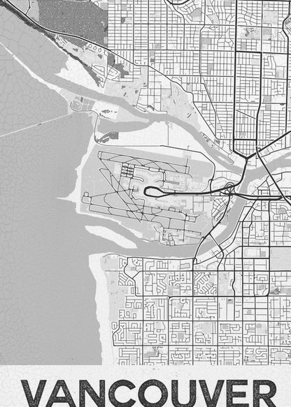 A modern, black and white framed art print of a city map of Vancouver. The map features a stylized layout of roads, rivers, and the coastline, including what appears to be an airport. The word 'VANCOUVER' is displayed in bold, capital letters at the bottom. Poster