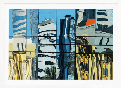 A framed abstract artwork showing a collage of distorted cityscape reflections in a grid of glass window panes. The reflections mix modern blue and white skyscrapers against a clear blue sky with older, golden-yellow buildings, creating a wavy and fragmented visual effect. Wall Art