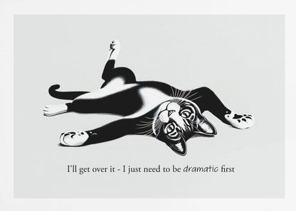 A framed black and white illustration of a tuxedo cat lying playfully on its back. Below the image is the text, 'I'll get over it - I just need to be dramatic first'. Artwork