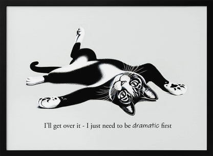 A framed black and white illustration of a tuxedo cat lying playfully on its back. Below the image is the text, 'I'll get over it - I just need to be dramatic first'. Artwork