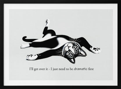 A framed black and white illustration of a tuxedo cat lying playfully on its back. Below the image is the text, 'I'll get over it - I just need to be dramatic first'. Artwork