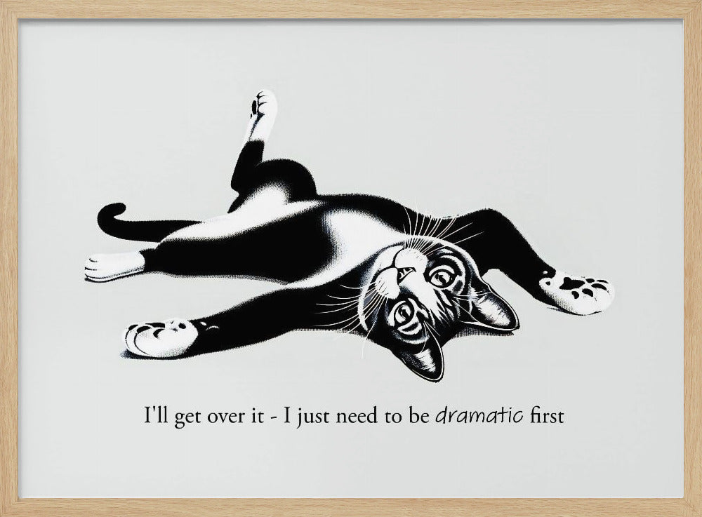 A framed black and white illustration of a tuxedo cat lying playfully on its back. Below the image is the text, 'I'll get over it - I just need to be dramatic first'. Artwork