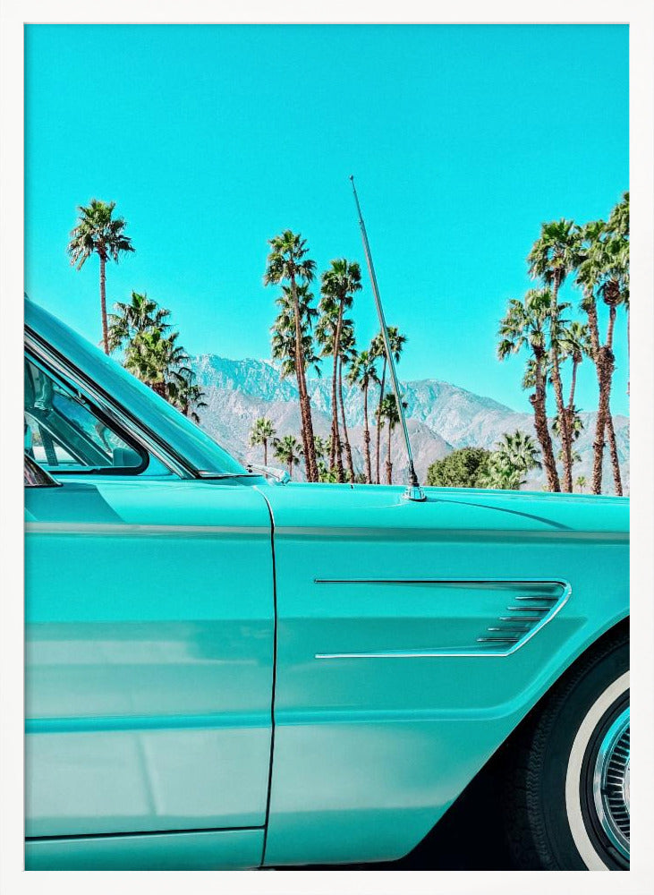 A vibrant, stylized photograph of a vintage turquoise car parked under a clear blue sky, with a row of tall palm trees and distant mountains creating a classic, sunny California scene. Wall Art