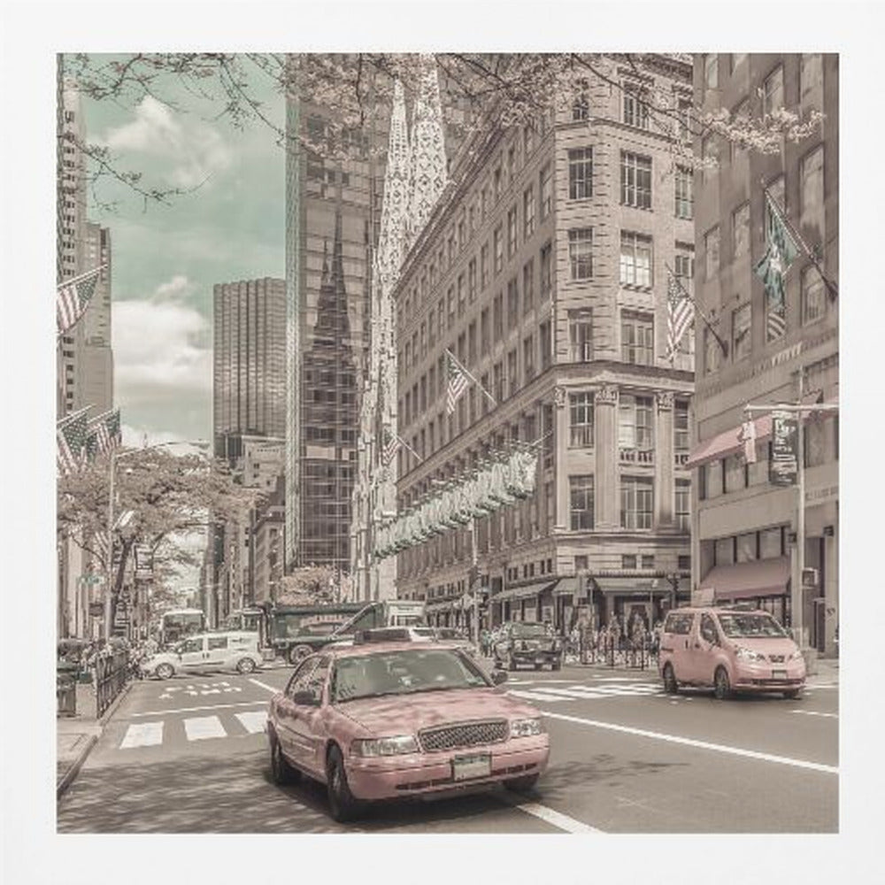 A framed photograph of a busy New York City street with a vintage, sepia-toned filter. Two cars, one in the foreground and one in the midground, are selectively colored a dusty pink, contrasting with the muted tones of the surrounding skyscrapers, American flags, and pedestrians. The sky is a pale teal color. Poster