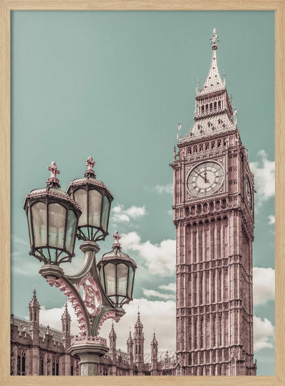 A stylized, low-angle photograph of Big Ben in London, with an ornate Victorian lamppost in the foreground. The image is color-graded with a pale teal sky and pink-toned architecture, creating a vintage, dreamy aesthetic. Wall Art