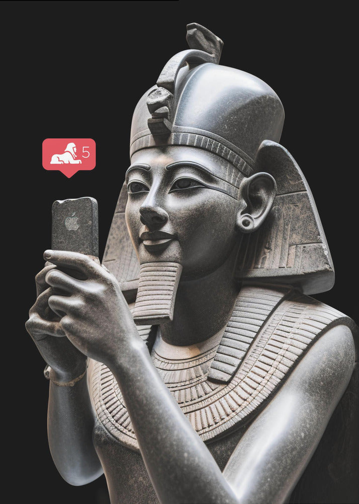 A humorous digital artwork depicting a detailed, dark grey stone bust of an ancient Egyptian pharaoh holding a modern smartphone and looking at it with a slight smile. A red social media notification with a sphinx icon and the number 5 floats next to the phone against a solid black background. Wall Art