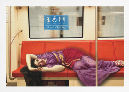 A framed surrealist artwork depicting a woman in a classical purple and red toga sleeping across a row of modern red subway seats. Above her on the window is a blue 'Priority Seating' sign, creating a humorous juxtaposition between ancient and modern life. Artwork