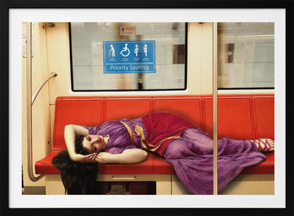 A framed surrealist artwork depicting a woman in a classical purple and red toga sleeping across a row of modern red subway seats. Above her on the window is a blue 'Priority Seating' sign, creating a humorous juxtaposition between ancient and modern life. Artwork
